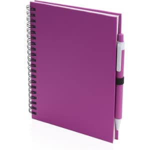 A pink spiral notebook featuring a matching pen attached with a black band. It has a smooth cover and wire binding.