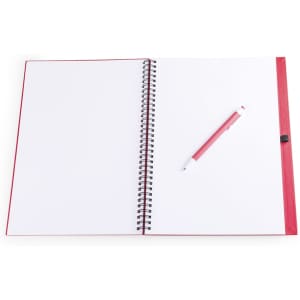 A red spiral notebook with blank pages and a pink pen resting on it. The notebook features a logo.
