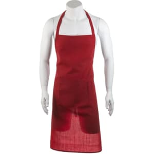 A red apron displayed on a mannequin, featuring a pocket and a neck strap. It has a simple design and a logo.