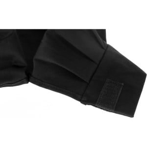 A black chef hat featuring pleats and a Velcro fastening at the back, suitable for chefwear uniforms.