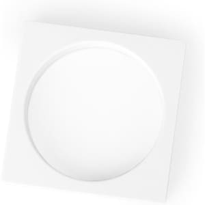 A square white plate with a circular indentation in the centre, featuring a smooth surface.