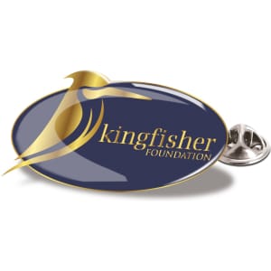 A lapel pin featuring an oval design in navy blue with a golden bird graphic and logo. Silver backing included.