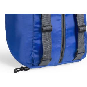 A blue backpack bag with grey straps and zippers, featuring a small attachment point.