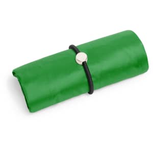 A green foldable bag secured with a black strap, featuring a simple round fastener.