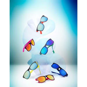 A display of Gredel sunglasses in various colours, including black, blue, green, pink, and red, with mirrored lenses.