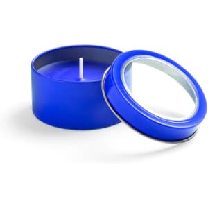 A blue aromatic candle in a round tin with a lid slightly removed. The candle has a white wick.