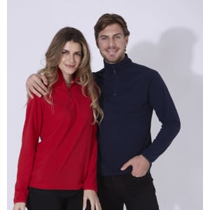 A red polar fleece jacket worn by a woman and a navy polar fleece jacket worn by a man, both featuring a zip.