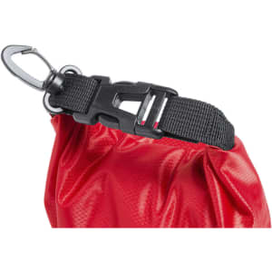 A red dry bag featuring a black buckle and clasp for secure fastening. It has a textured surface.