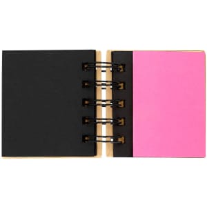 A sticky notepad with a black cover and pink sticky notes inside, featuring a ring binder.