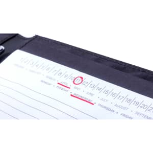 A black compendium featuring a calendar page with the date highlighted as Wednesday, May 11.