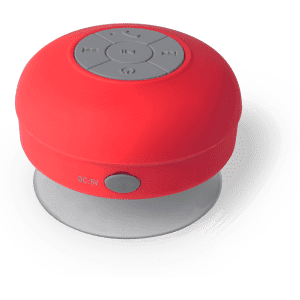 A red portable speaker with control buttons on top and a suction cup base for attachment.