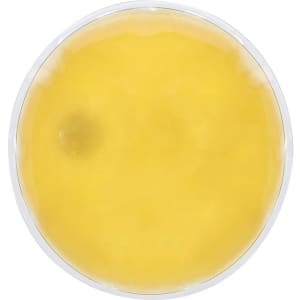 A circular heat pack with a yellow gel inside, featuring a transparent outer casing and a branding logo.