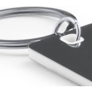 A silver keyring featuring a rectangular metal tag with a hole, attached to a circular ring.