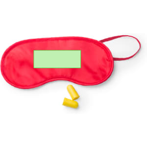 A red sleep mask with a green area for customisation, accompanied by yellow earplugs.