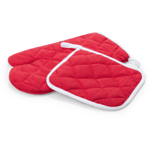 A red quilted oven mitt and pot holder set with white trim, featuring a textured surface.