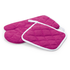 A pink quilted oven mitt set including two mitts and a pot holder, all featuring a white trim.