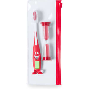 A red toothbrush with a character design, accompanied by a red hourglass timer, all packaged in a clear zip pouch.