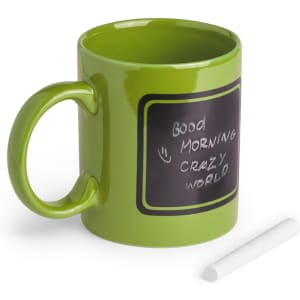 A green coffee mug with a chalkboard surface and a white chalk piece beside it. It features a logo.