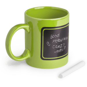 A bright green coffee mug with a chalkboard-style surface and a piece of chalk beside it.