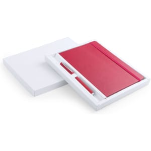 A red notebook and pen set displayed in a white gift box. The notebook features a smooth finish and a matching pen.
