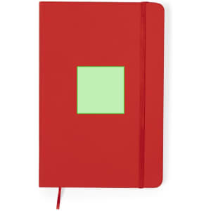 A red notebook with a green square on the cover, featuring an elastic band and a ribbon marker.