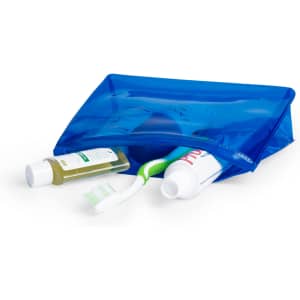 A blue toiletry bag containing a toothbrush, toothpaste, and bottles of liquid. It features a zip closure and has a logo.