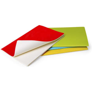 Three notebooks in vibrant colours: red, green, and yellow, stacked with a visible white cover. Each notebook features a smooth finish.