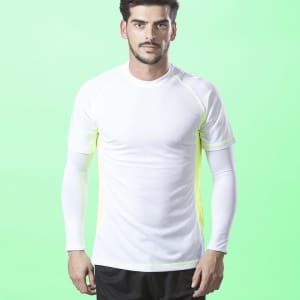 A man wearing a white athletic shirt with long sleeves and neon yellow accents, set against a green background.
