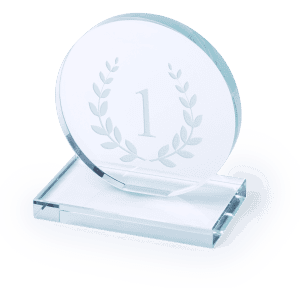 A clear glass plaque features a laurel wreath design, mounted on a rectangular base, showcasing the number one.