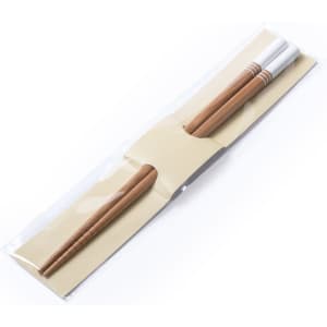 A set of bamboo chopsticks in a clear package, featuring a white and a brown chopstick.