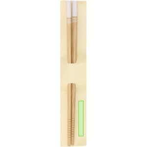A set of gold chopsticks displayed in a light yellow packaging, featuring a logo.