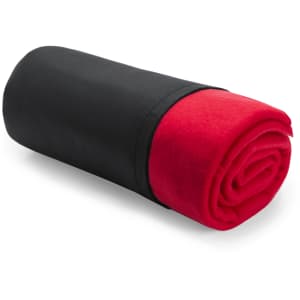 A rolled blanket featuring a vibrant red interior and a sleek black exterior, with an accompanying logo.