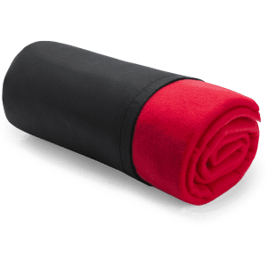 A rolled blanket featuring red fleece and a black exterior, compactly stored. It includes a logo on the fabric.