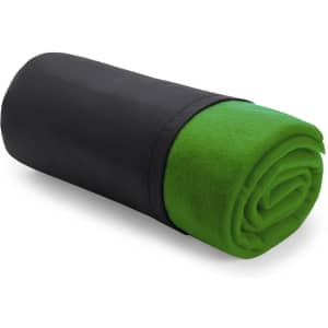 A rolled blanket with a vibrant green interior and a black exterior, featuring a logo.