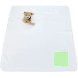 A soft white blanket with a plush toy on top and a small green area at the bottom corner.