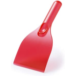 A red ice scraper with a smooth handle and wide scraping blade. It features a simple, practical design.