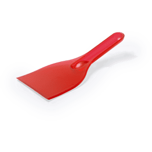 A red ice scraper with a flat blade and a handle, designed for removing ice and snow.