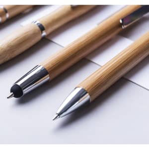 A set of wooden pens in natural bamboo with silver accents, displayed on a white surface.