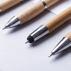 A collection of bamboo stylus touch ball pens featuring chrome accents in a natural finish.