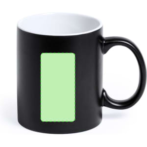 A black coffee mug with a glossy white interior and a blank green rectangular space for custom designs.