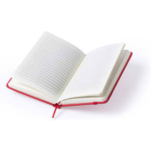 A red Kinelin notepad with lined pages, featuring an open layout. The notepad includes a binding and a bookmark.