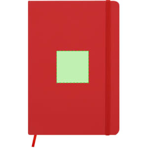 A red notepad with a green square on the front and an elastic band closure. Features branding.