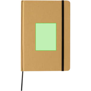A tan notepad with a green section on the cover and a black elastic band securing it closed.