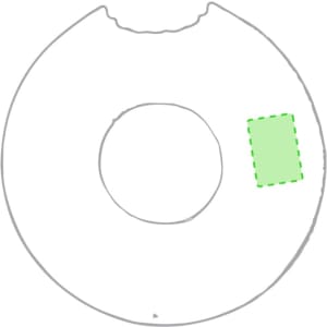 A round air mattress designed like a donut, featuring a centre hole and a green outline on one side.