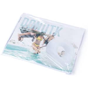 A white air mattress in packaging, featuring a circular design and a branding logo.
