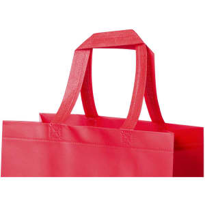 A red tote bag with two sturdy handles, featuring a simple and minimalist design.