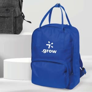 A blue backpack with a front pocket and a logo, featuring two handles and adjustable straps.