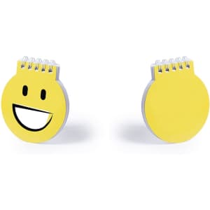 A yellow spiral-bound notebook shaped like a smiley face with a large smiling mouth graphic.