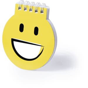 A circular, yellow notebook featuring a smiley face design, with a spiral binding at the top and a visible logo.