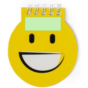 A round, yellow notebook featuring a smiling face design with a green area for notes. It has a spiral binding.